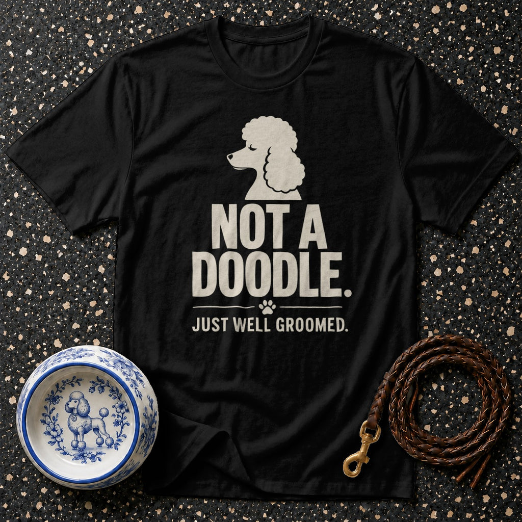 Black t-shirt with "NOT A DOODLE. JUST WELL GROOMED." text and poodle graphic.