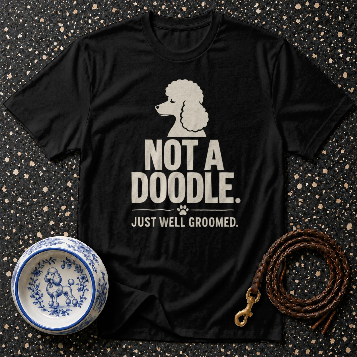 Black t-shirt with "NOT A DOODLE. JUST WELL GROOMED." text and poodle graphic.