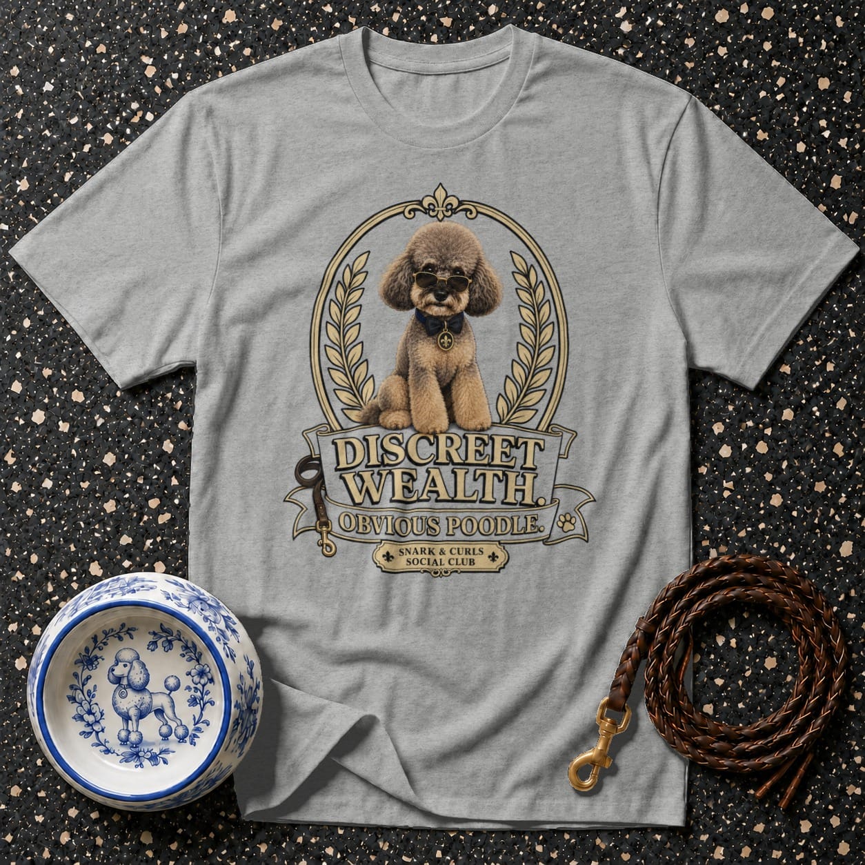 Grey t-shirt with "Discreet Wealth Obvious Poodle" graphic of a poodle wearing sunglasses.