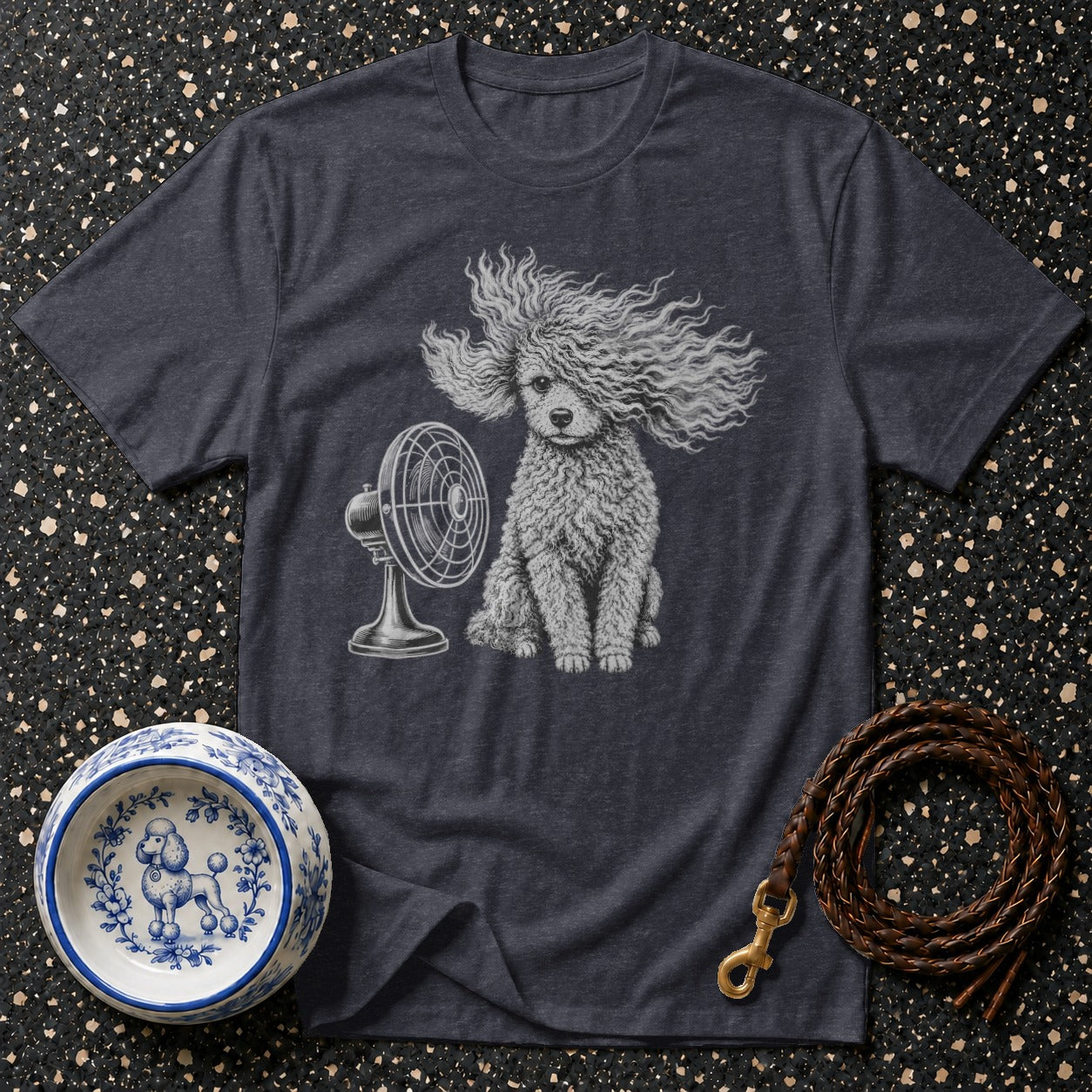 Dark grey t-shirt with a poodle in front of a fan, next to a dog bowl.