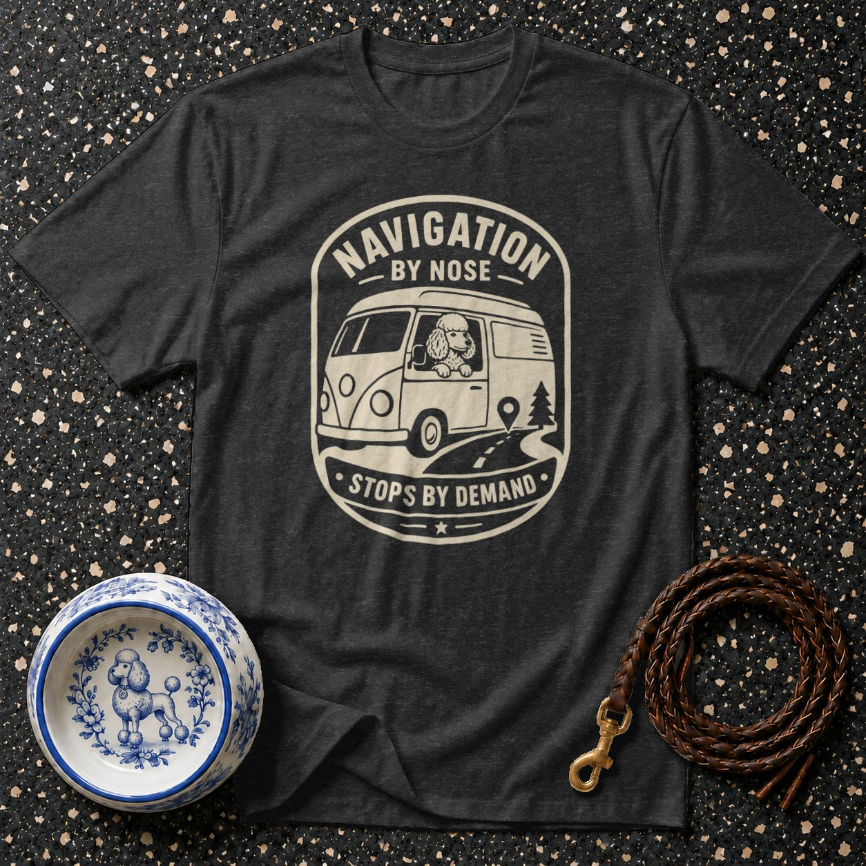 Dark t-shirt with "Navigation by Nose Stops by Demand" graphic featuring a poodle in a van.