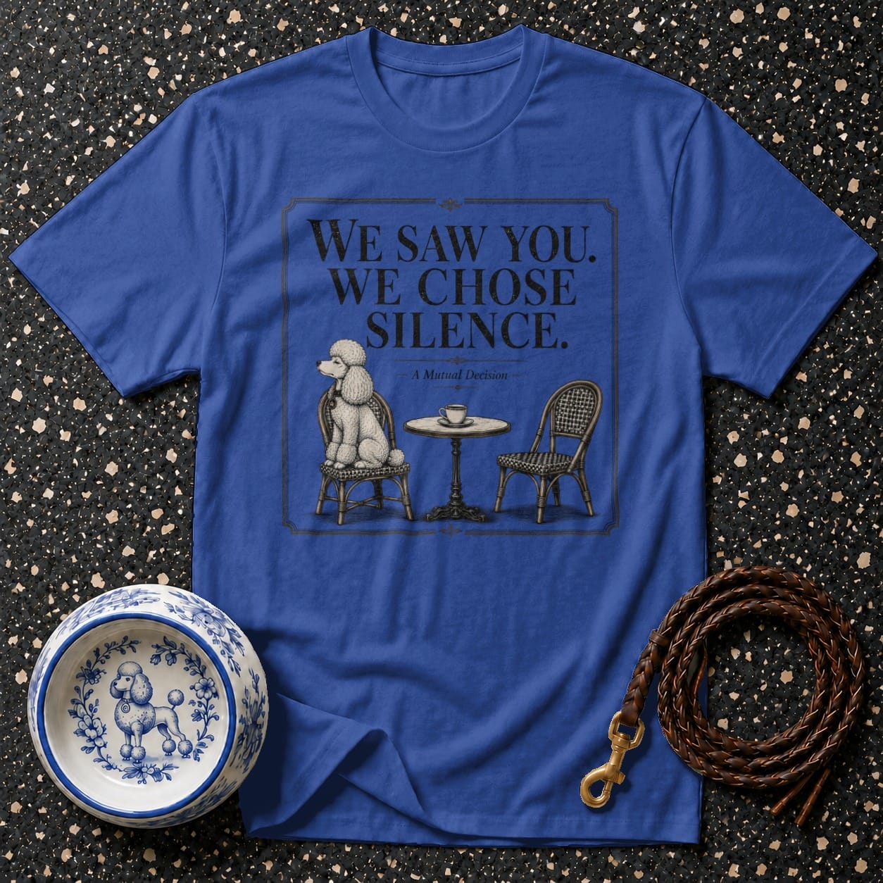 Royal blue t-shirt with illustration of poodle and text "We Saw You. We Chose Silence."