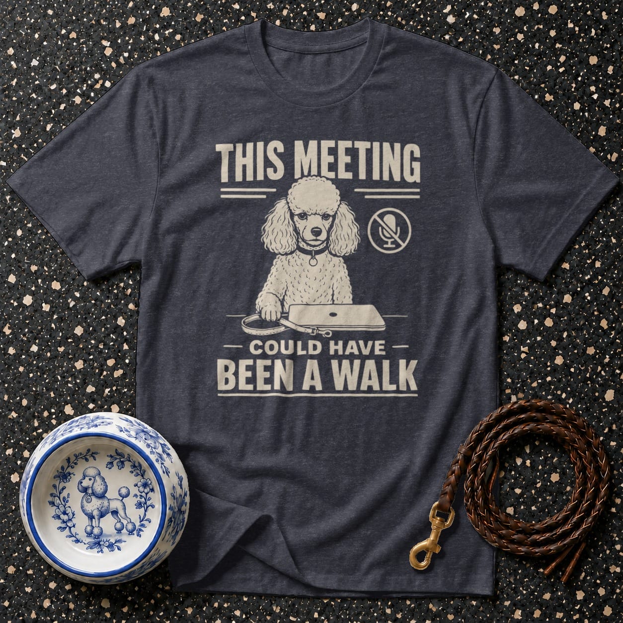 Dark t-shirt with white text and poodle graphic: "This meeting could have been a walk."