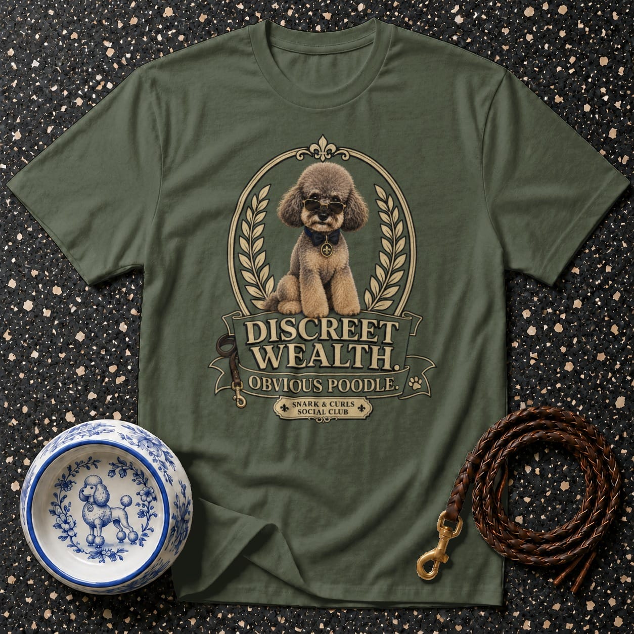 Green t-shirt with a poodle graphic reading "Discreet Wealth. Obvious Poodle."