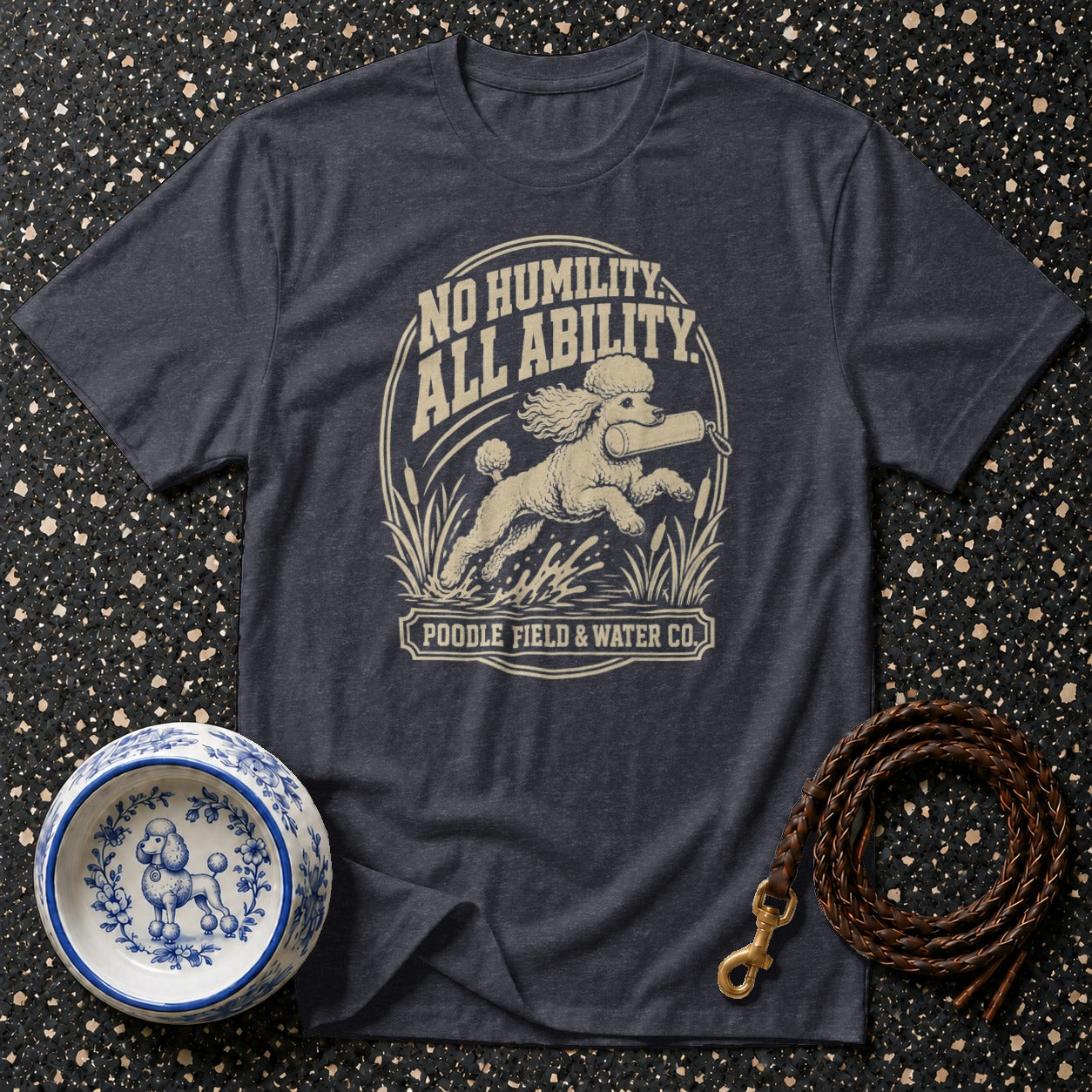 Dark grey t-shirt with poodle retrieving dummy text "NO HUMILITY. ALL ABILITY. POODLE FIELD & WATER CO."