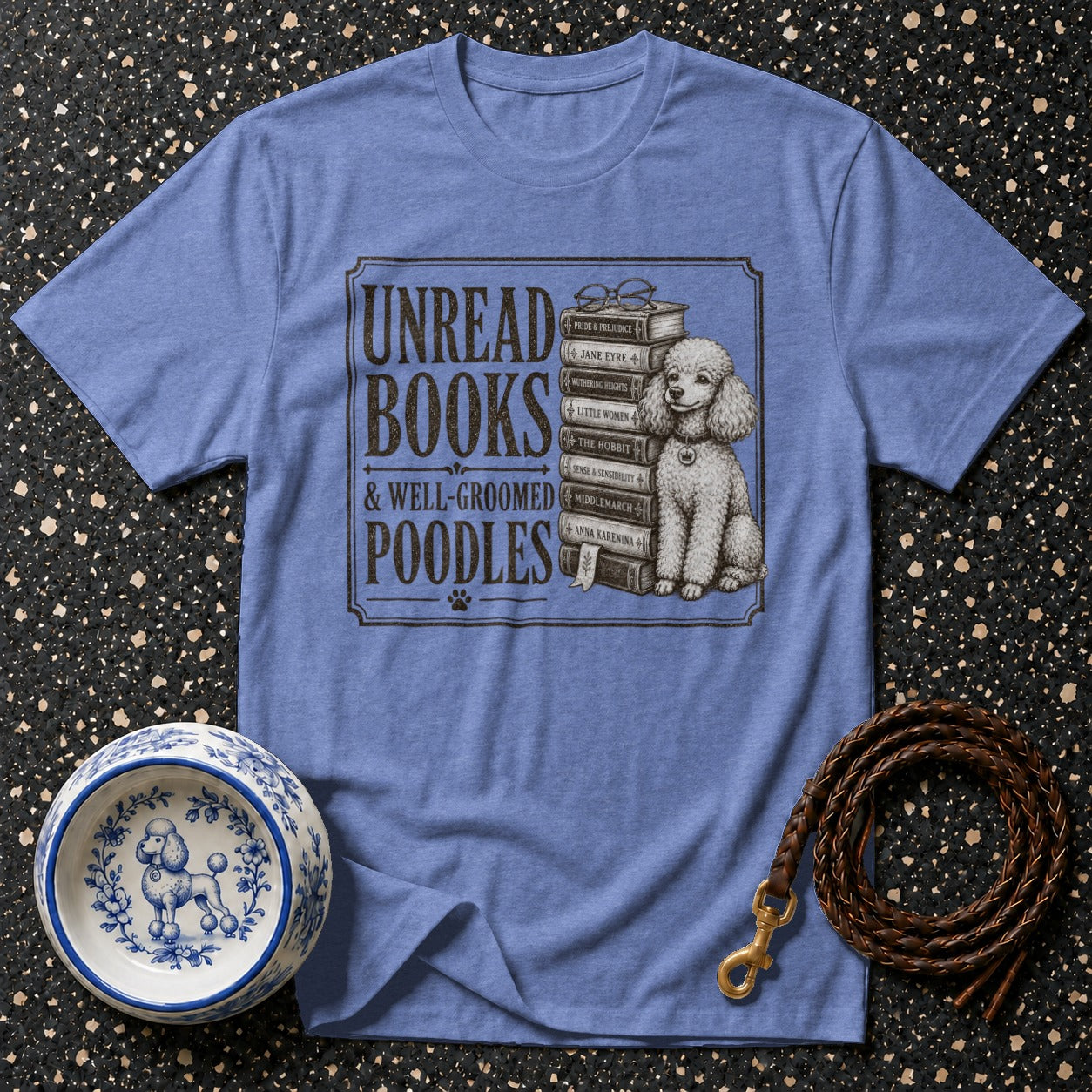 T-shirt with "Unread Books & Well-Groomed Poodles" text and a poodle beside stacked books.