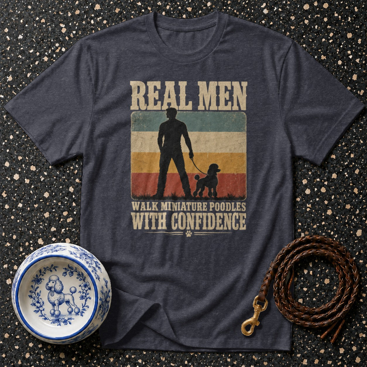 Dark t-shirt with text "REAL MEN WALK MINIATURE POODLES WITH CONFIDENCE".