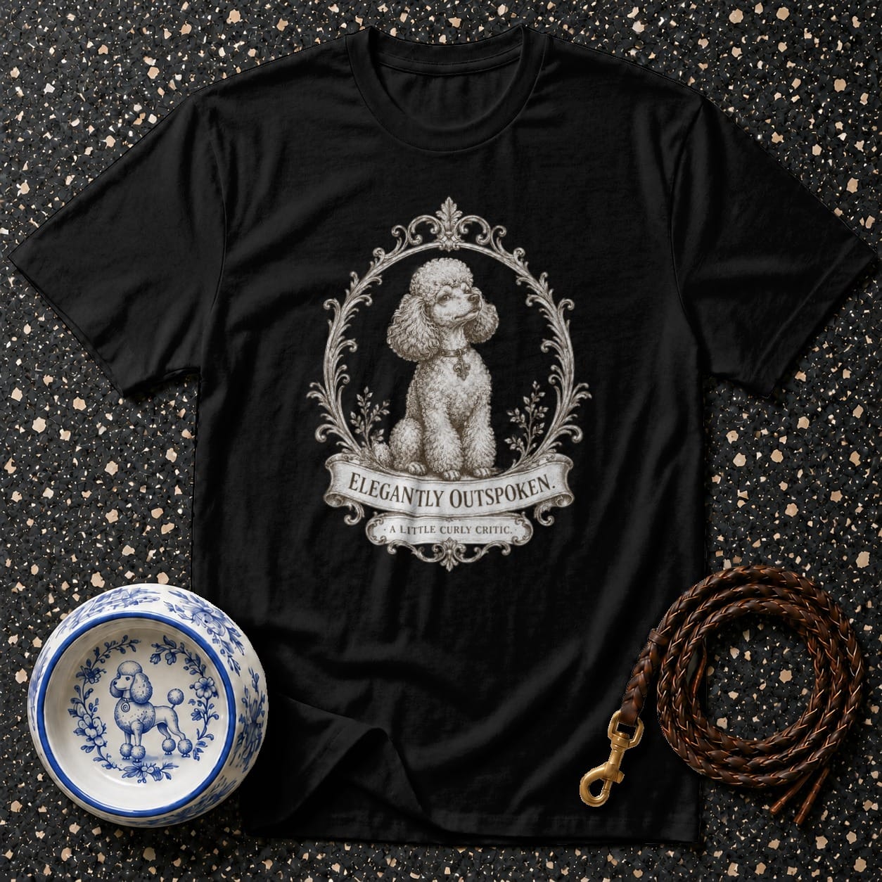 Black t-shirt with poodle art and "Elegantly Outspoken." text.