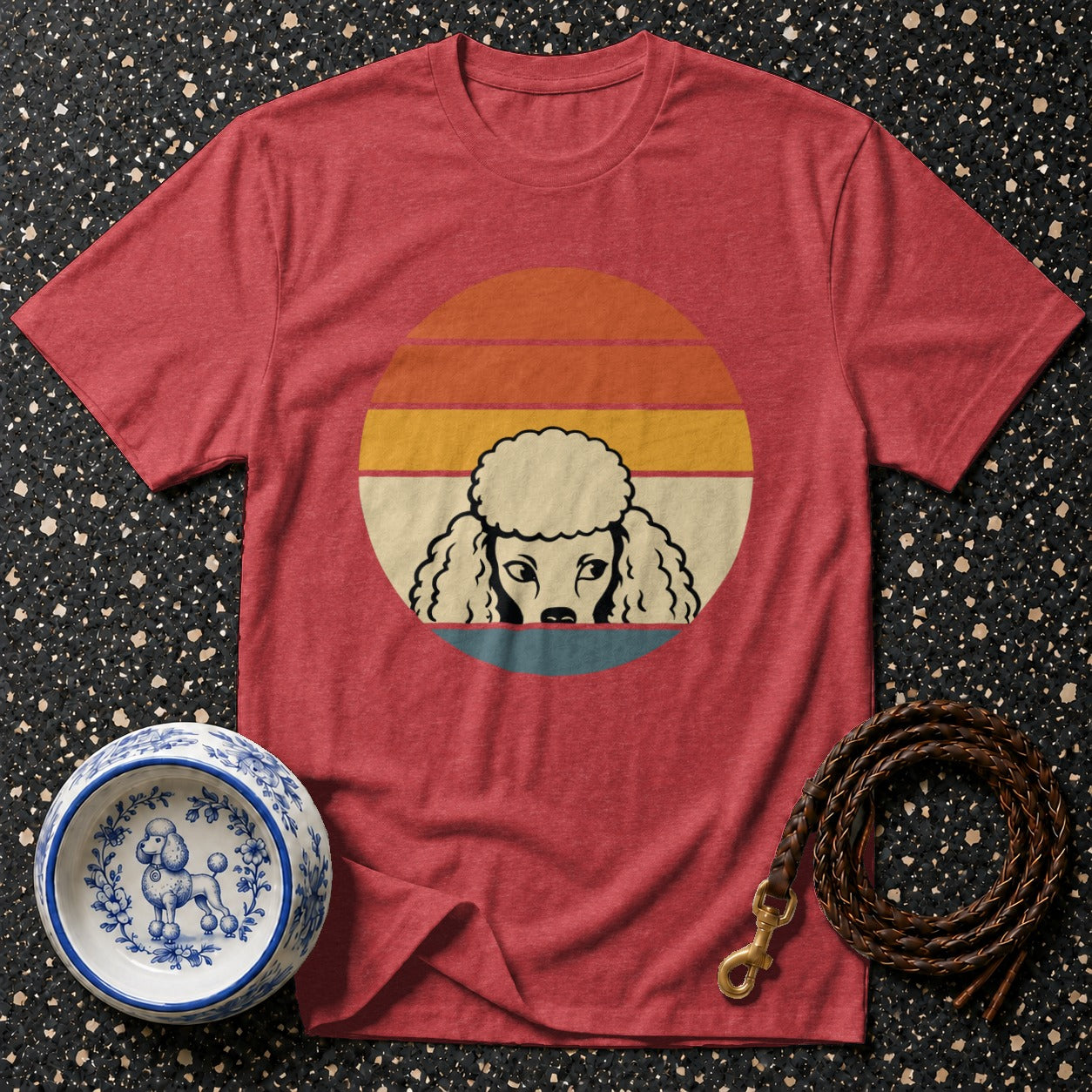 Red t-shirt with retro poodle graphic, dog bowl, and braided leash.