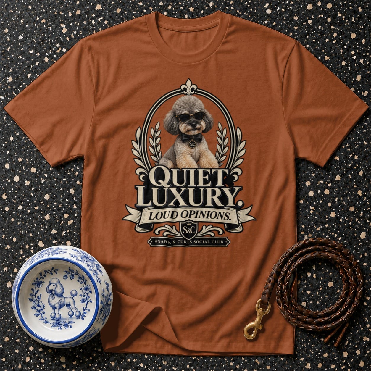 Brown t-shirt with a poodle wearing sunglasses and text "Quiet Luxury Loud Opinions."