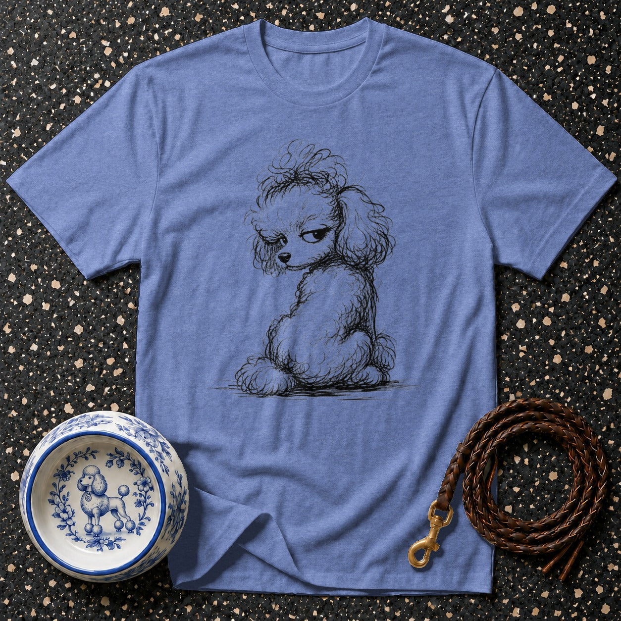Blue t-shirt with sketch of a poodle, a decorative dog bowl, and a leather leash.
