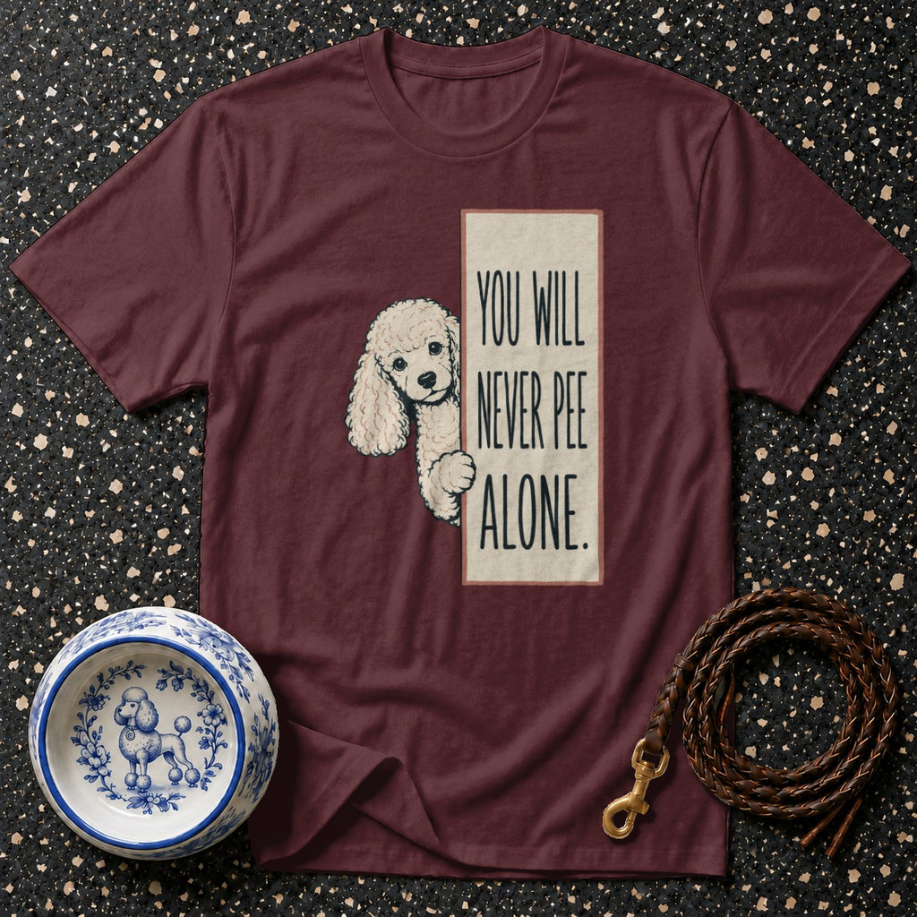 Maroon t-shirt with poodle graphic and text "You Will Never Pee Alone".