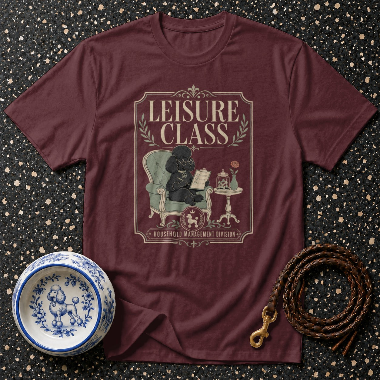 Maroon t-shirt with "LEISURE CLASS HOUSEHOLD MANAGEMENT DIVISION" graphic of a poodle.
