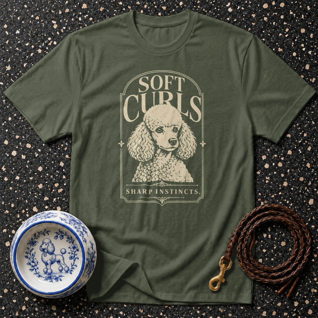 Green t-shirt with poodle graphic and text "Soft Curls Sharp Instincts".