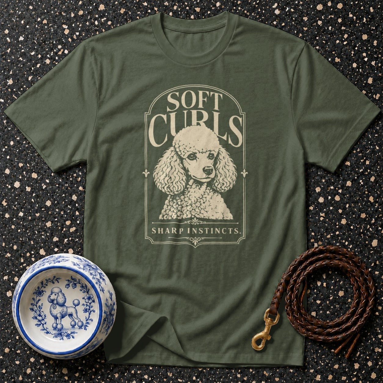 Green t-shirt with poodle graphic and text "Soft Curls Sharp Instincts".