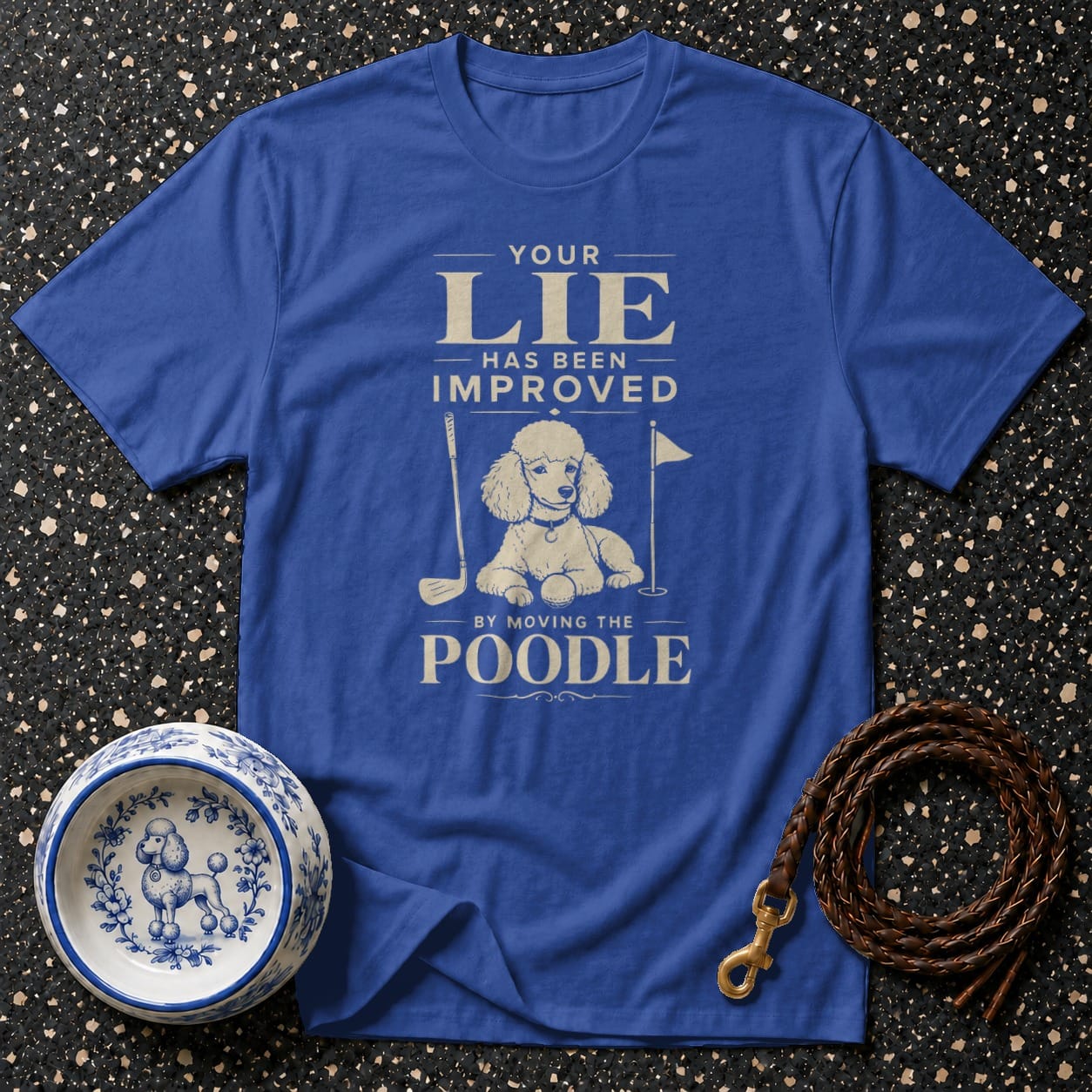 Blue t-shirt with "Your Lie Has Been Improved By Moving The Poodle" text and poodle graphic.