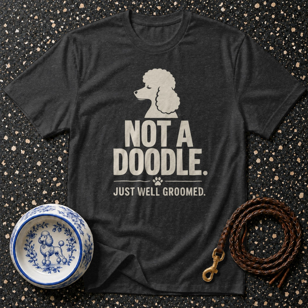 Dark gray t-shirt with white text "Not a Doodle. Just well groomed" and poodle graphic.