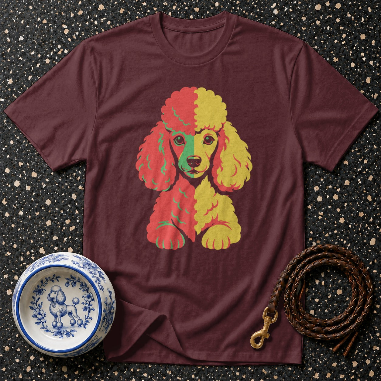 Maroon t-shirt with a multi-colored poodle graphic and poodle-decorated pet bowl.