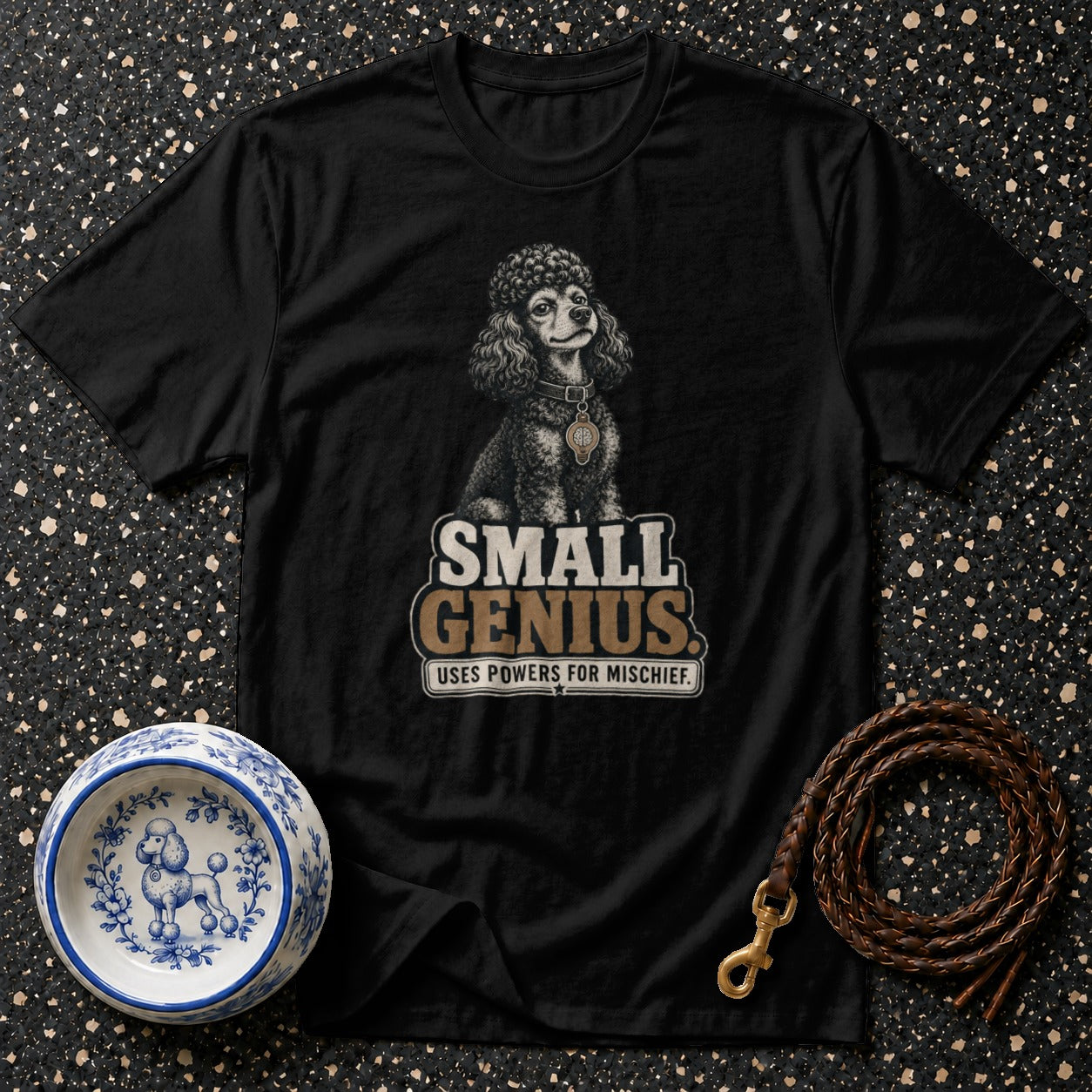 Black t-shirt with a poodle graphic and text: "SMALL GENIUS USES POWERS FOR MISCHIEF."