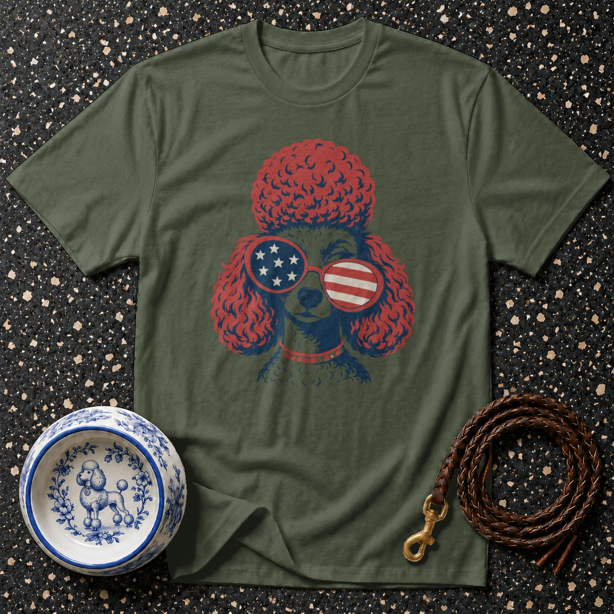 Olive green t-shirt with a poodle wearing American flag sunglasses and patriotic accessories.