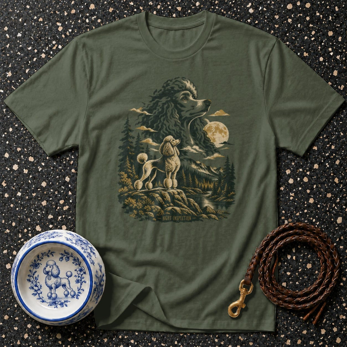 Green t-shirt with a graphic of two poodles in a moonlit mountain forest scene.