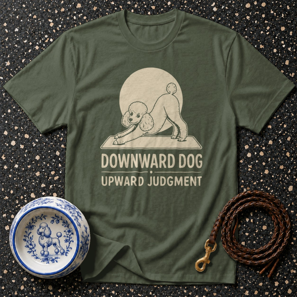 Green t-shirt with a poodle doing a downward dog pose and the text "Downward Dog Upward Judgment".