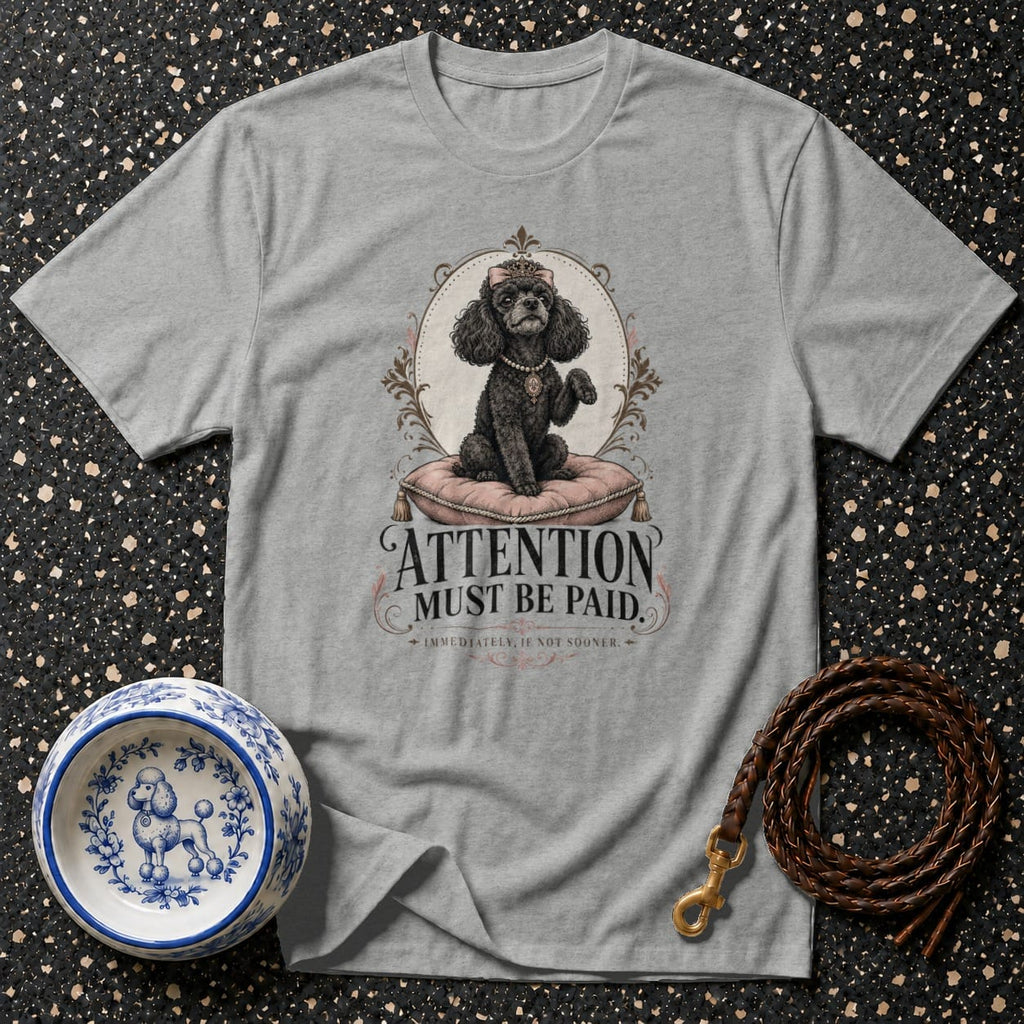 Grey t-shirt with a black poodle wearing a crown and "Attention Must Be Paid" text.