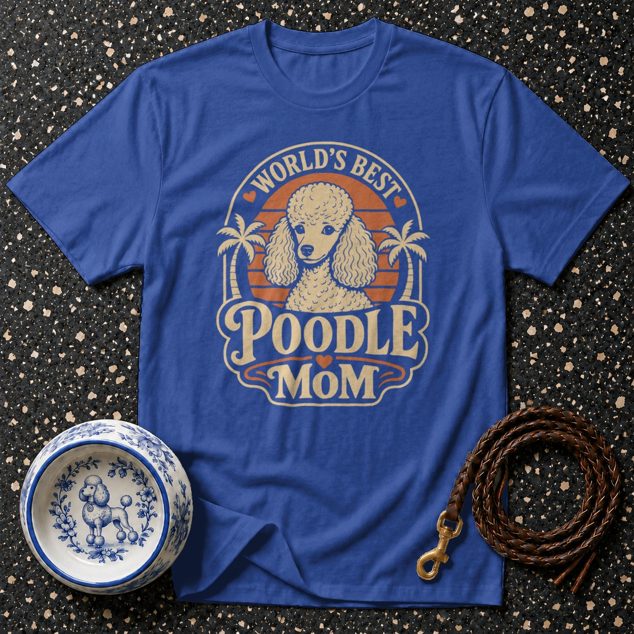 Blue t-shirt with "World's Best Poodle Mom" text and poodle graphic.