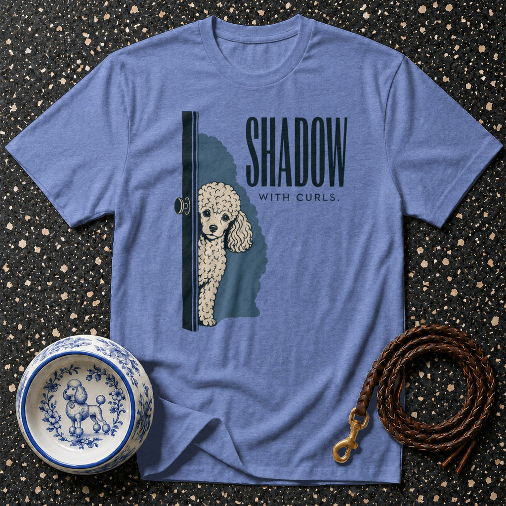 Blue t-shirt with poodle peeking from door and "SHADOW WITH CURLS." text.