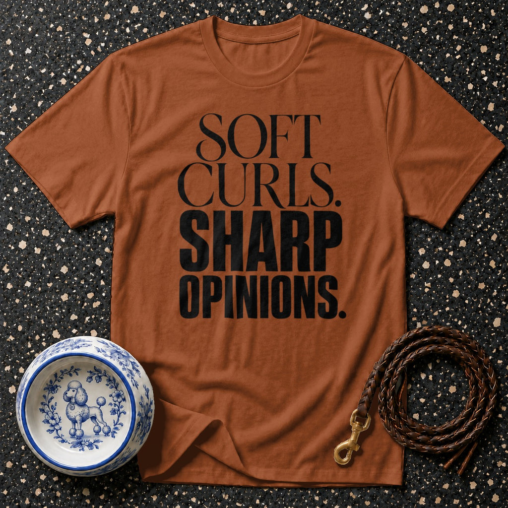 Brown t-shirt with black text "SOFT CURLS. SHARP OPINIONS."