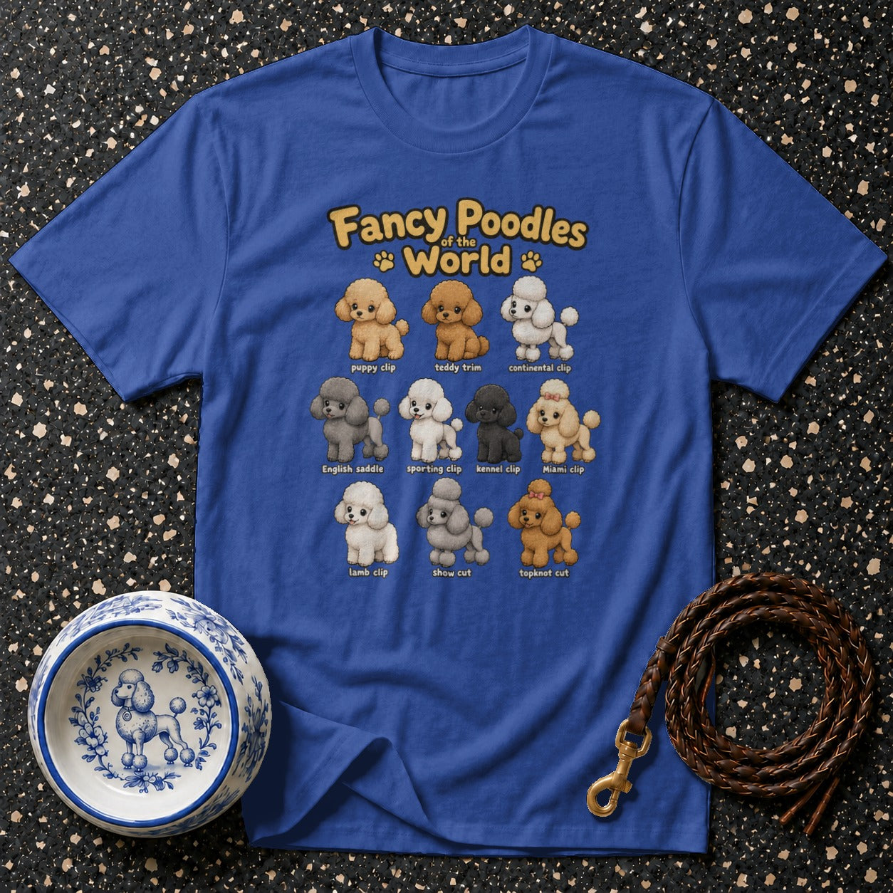 Blue t-shirt with cartoon poodles of various clips and breeds. Fancy Poodles of the World title.