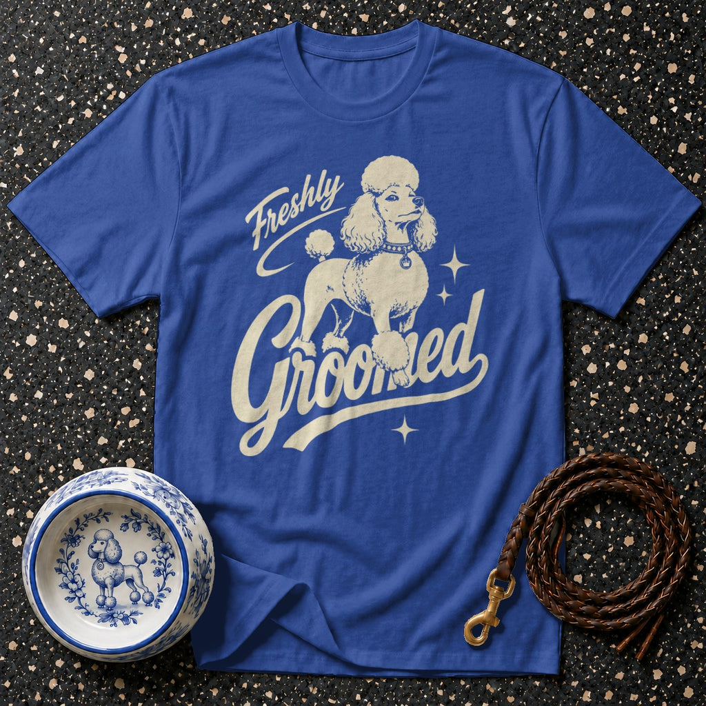 Royal blue t-shirt with a vintage poodle graphic and text "Freshly Groomed".