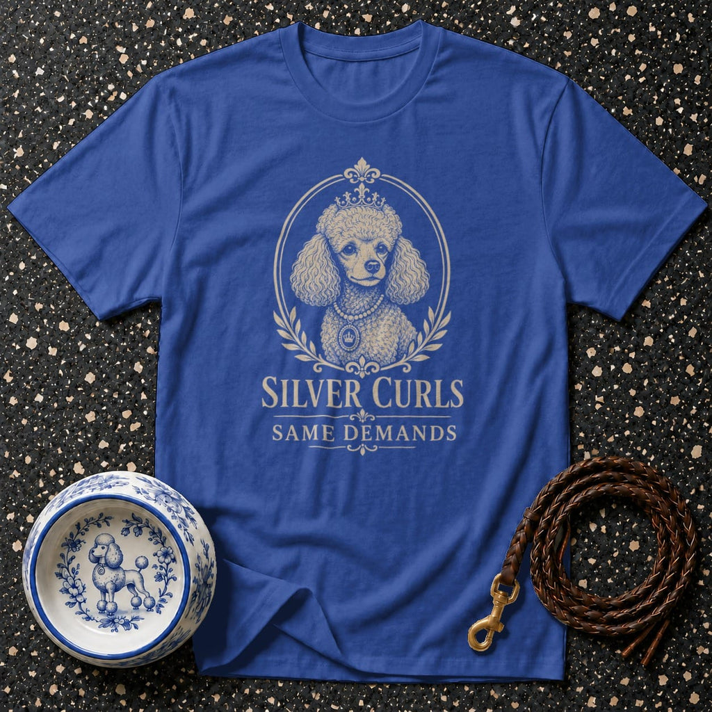 Royal blue t-shirt with a poodle graphic, text "SILVER CURLS SAME DEMANDS", dog bowl, and leash.