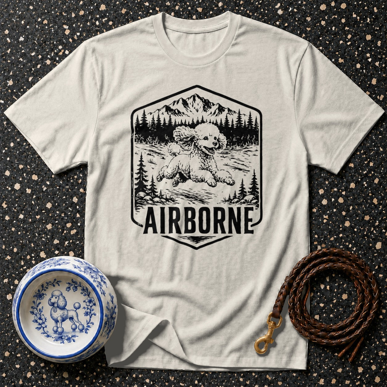 White t-shirt with "Airborne" text and a poodle in a mountain landscape.