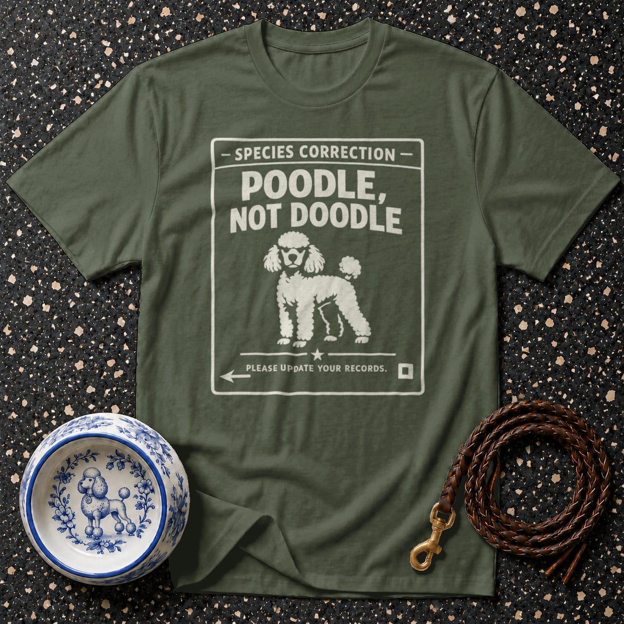 Green t-shirt with "Species Correction: Poodle, Not Doodle" and a poodle illustration.