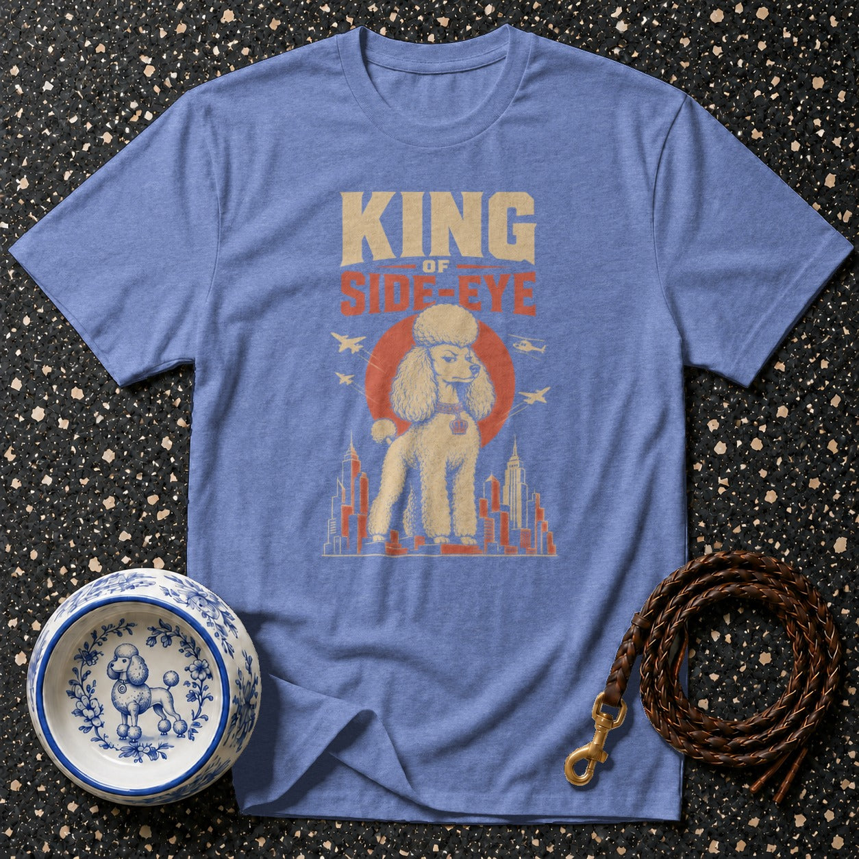 Blue t-shirt with "KING OF SIDE-EYE" text and poodle graphic.