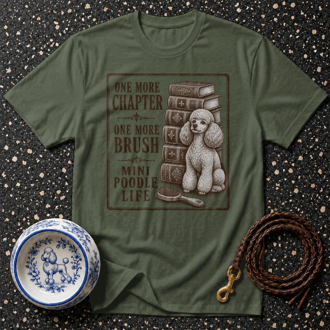 Green t-shirt with text "ONE MORE CHAPTER ONE MORE BRUSH MINI POODLE LIFE" and poodle illustration.