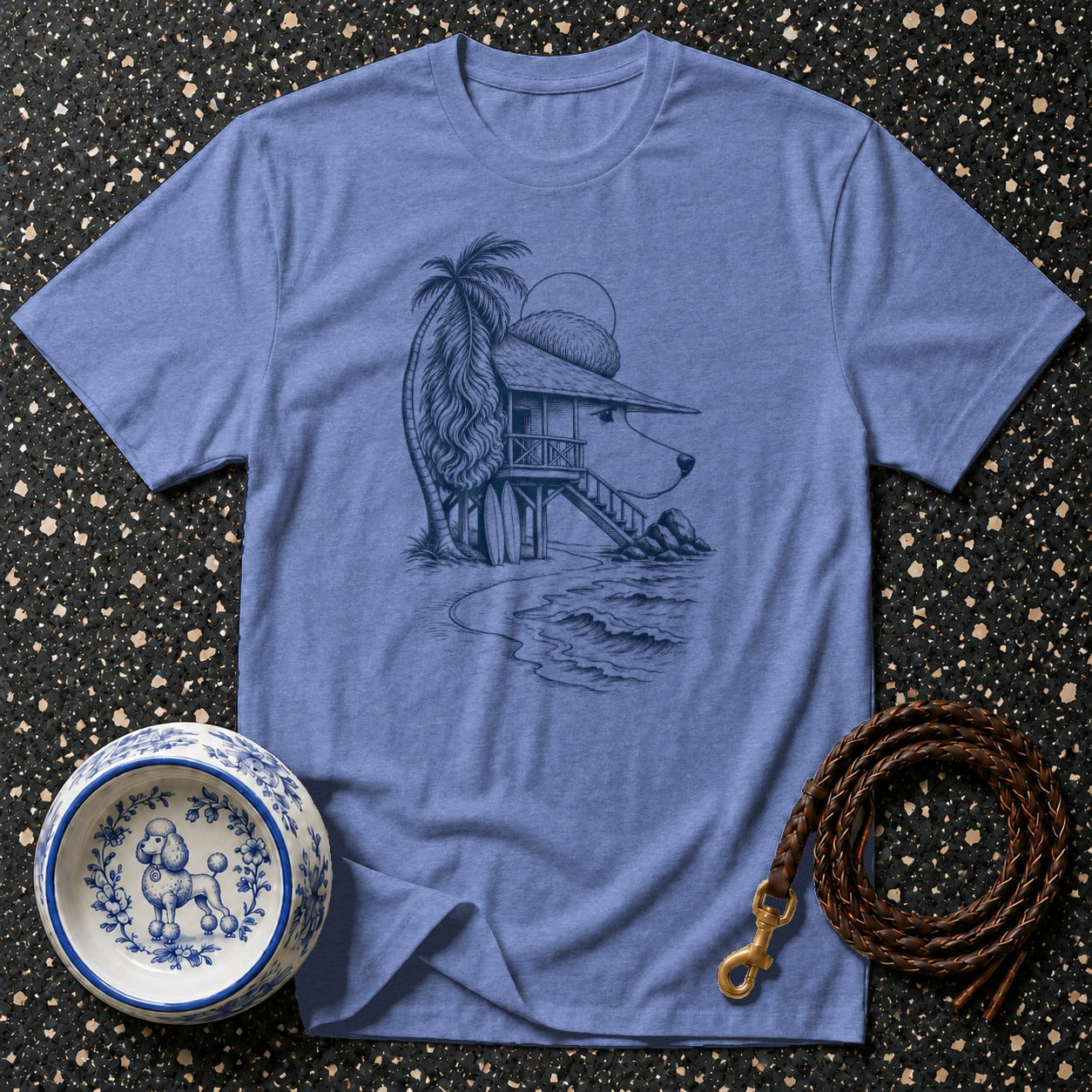 Blue t-shirt with dog-shaped beach house illustration and poodle dog bowl.
