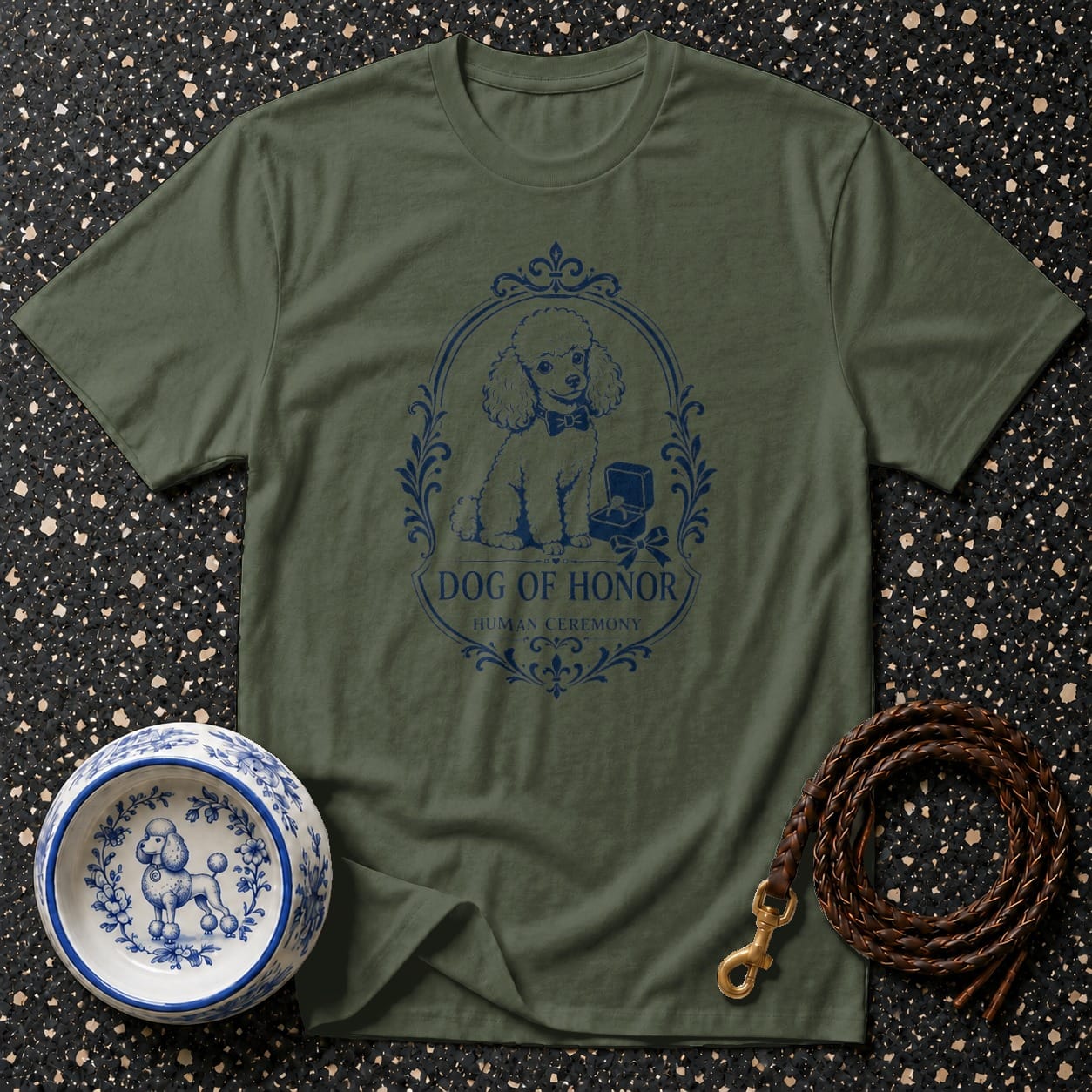 Green t-shirt with a blue oval design featuring a poodle and text, "Dog of Honor Human Ceremony".