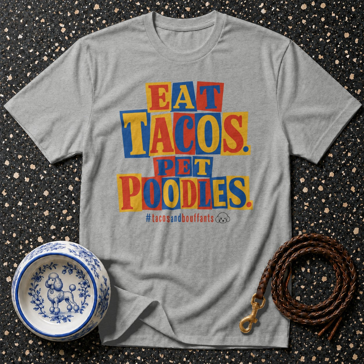 Grey t-shirt with "Eat Tacos. Pet Poodles." text and hashtag #tacosandbouffants.