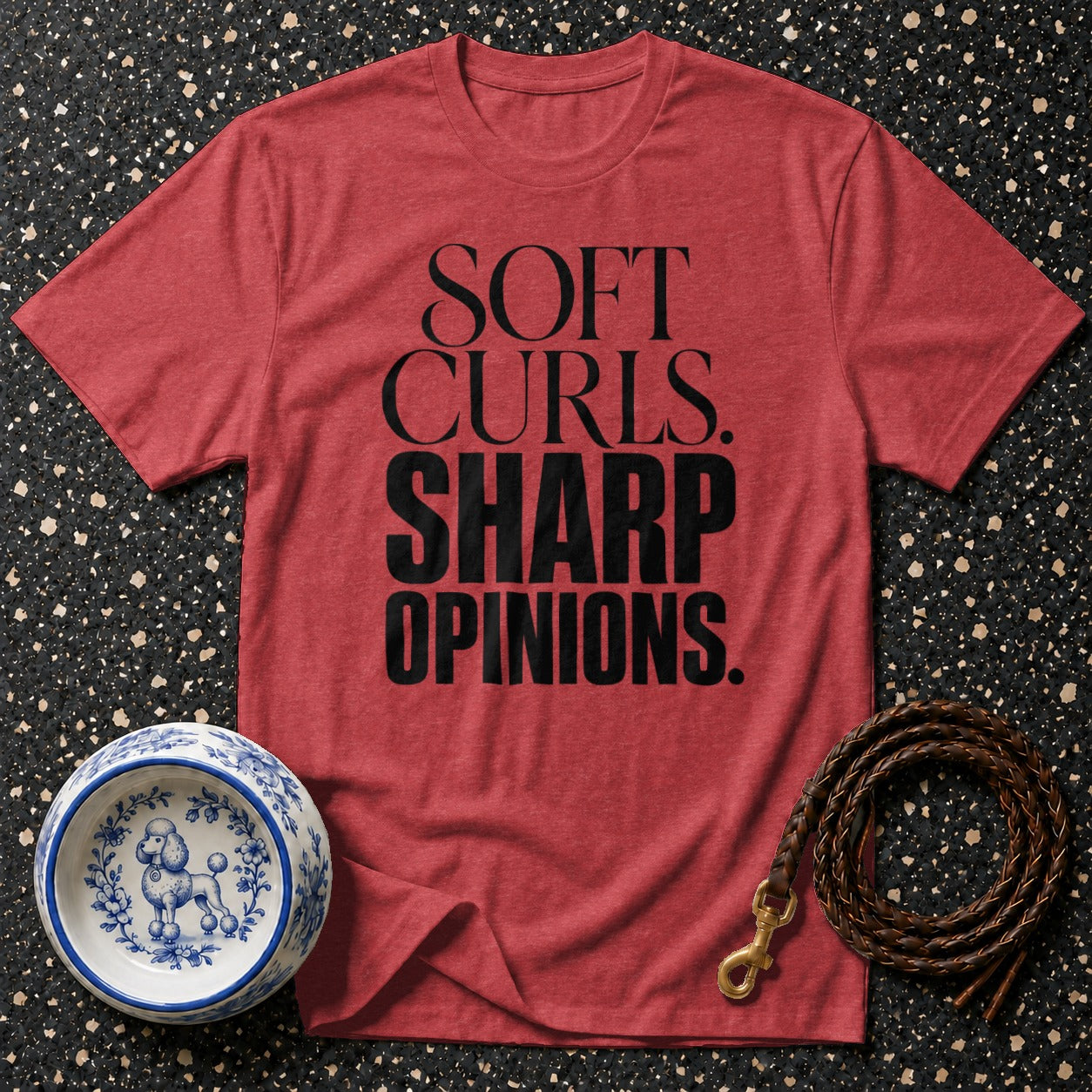 Red t-shirt with black text reading "SOFT CURLS. SHARP OPINIONS."