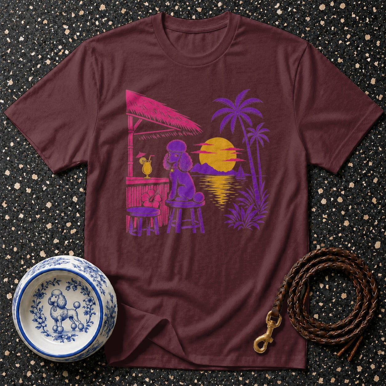 Maroon t-shirt with a purple poodle at a bar during a tropical sunset.