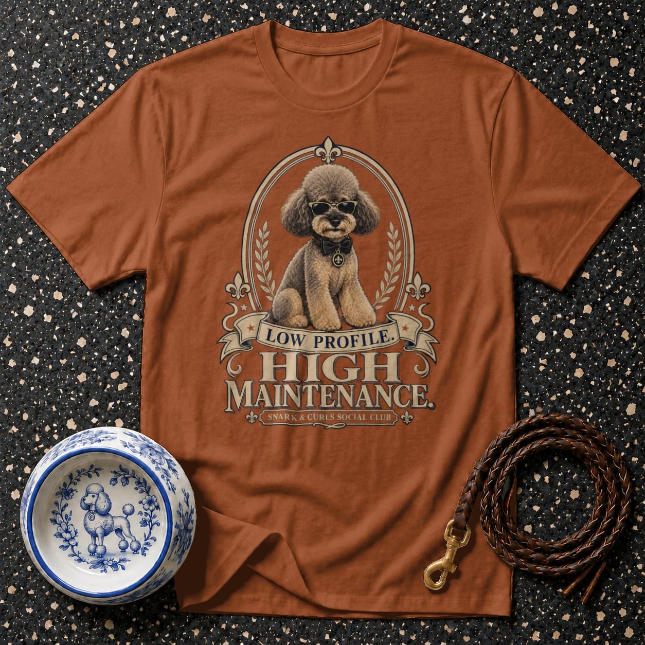 Brown t-shirt with poodle graphic and "Low Profile. High Maintenance." text.