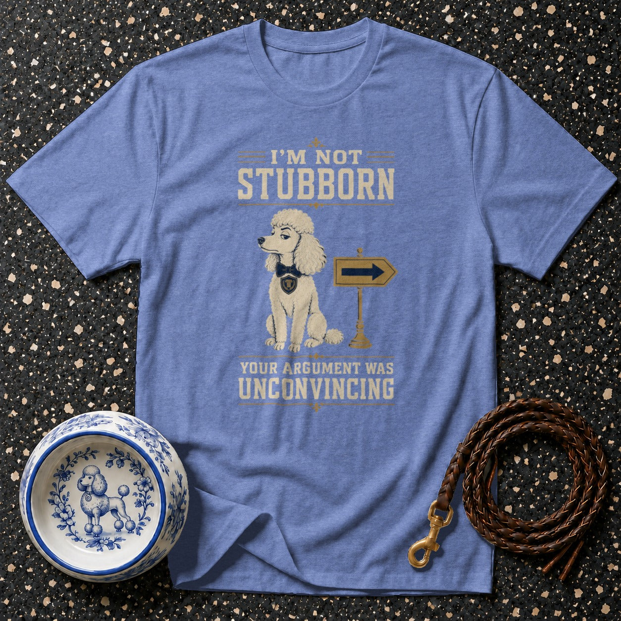 Blue t-shirt with poodle illustration and text "I'm not stubborn, your argument was unconvincing".