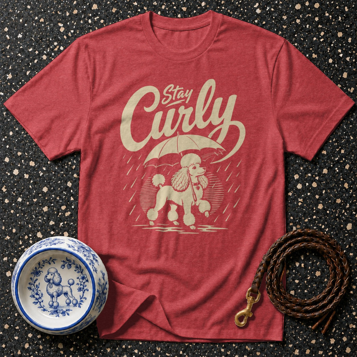 Red t-shirt with a poodle and umbrella graphic and "Stay Curly" text.