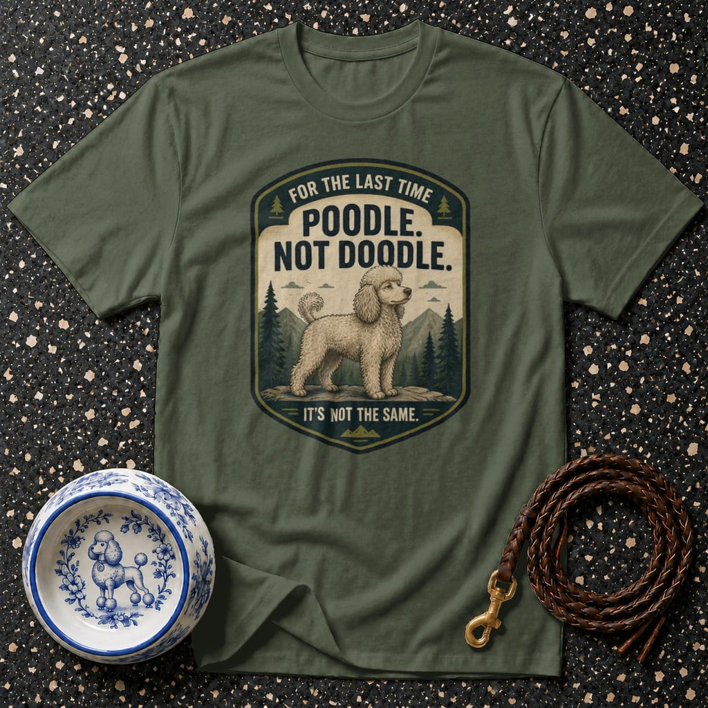 Green t-shirt with distressed emblem: "Poodle. Not Doodle. It's Not The Same."
