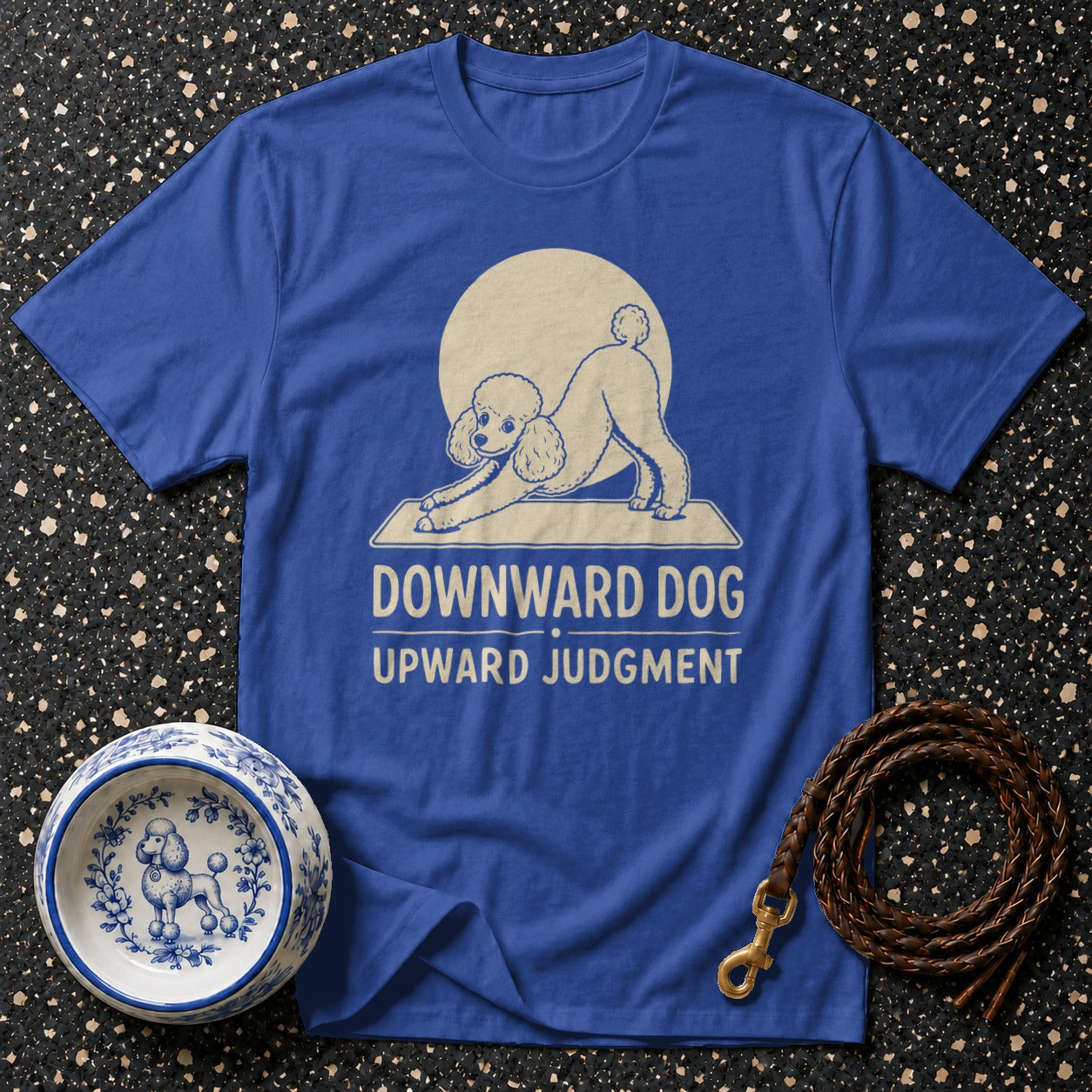 Blue t-shirt with a poodle in a downward dog pose and text "Downward Dog Upward Judgment".