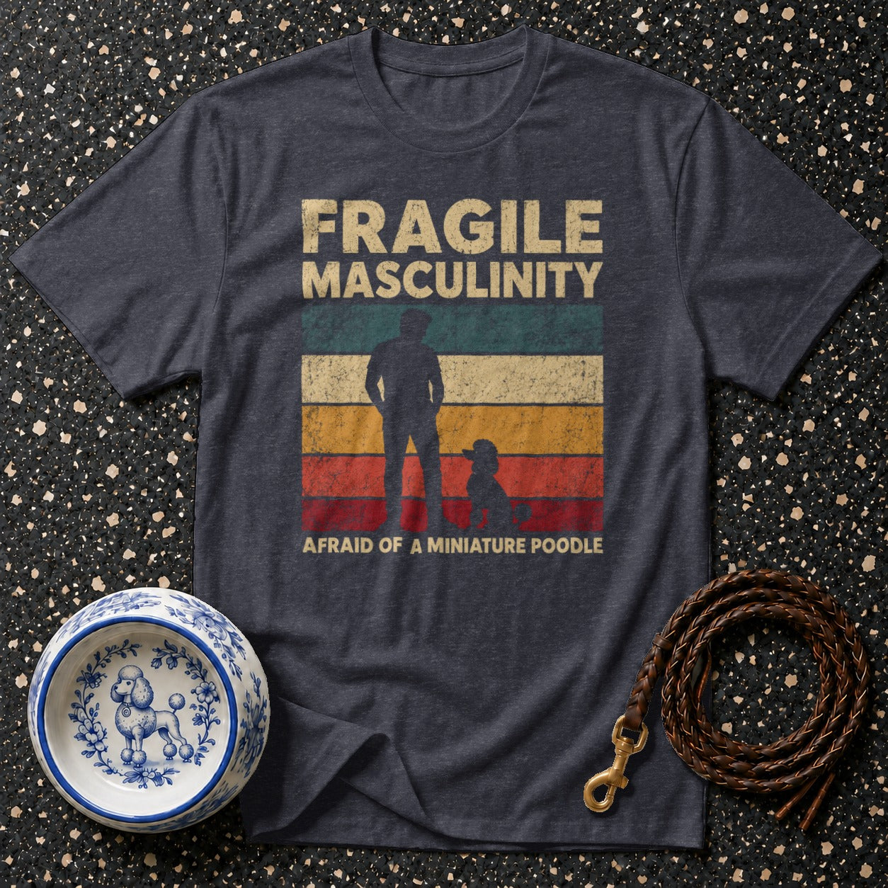 T-shirt with text "Fragile Masculinity" and silhouette of man and poodle.