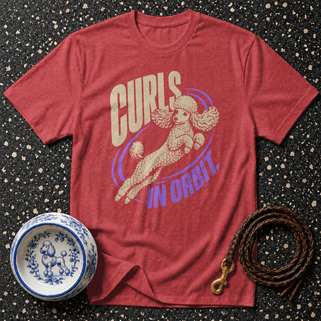 Red t-shirt with poodle graphic and text "Curls in Orbit".