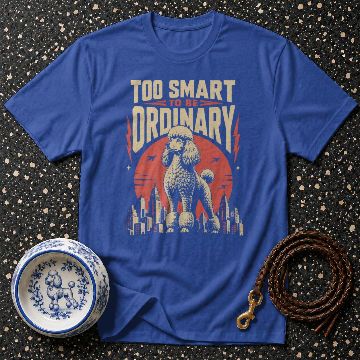 Blue t-shirt with a poodle graphic and the text "TOO SMART TO BE ORDINARY".